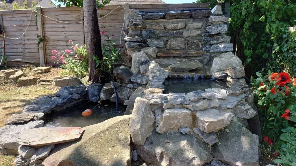 Decking, raised planters and water feature