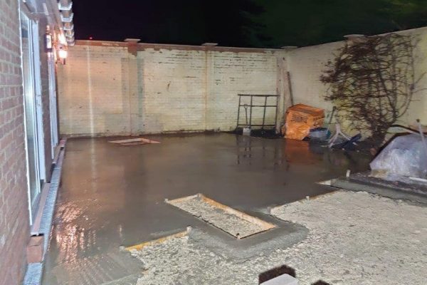 Concrete base poured across the courtyard